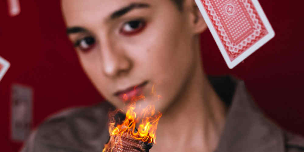 gambling trick with flaming cards