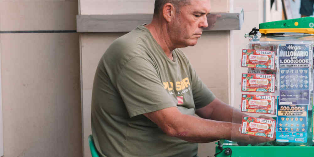 man selling scratch cards