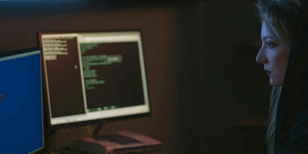 female dark web betting bots user sits at pc