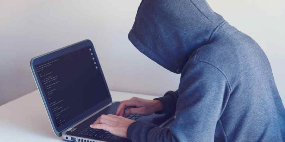 dark web betting bots user sits at laptop