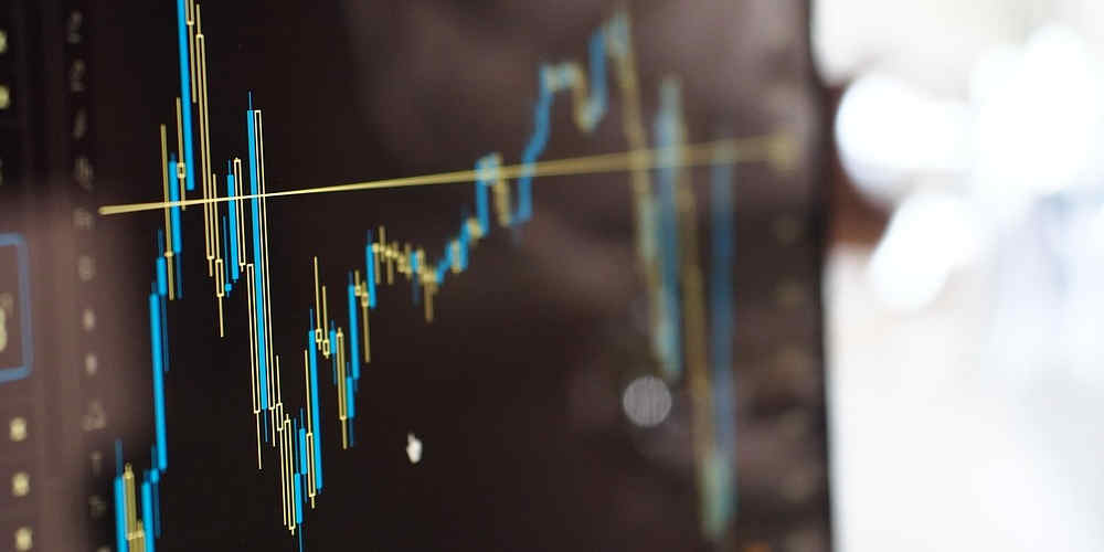 stock market betting represented with stock report on screen