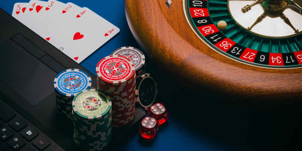 casino wins with AI represented with casino items on a laptop