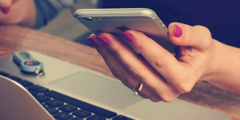 punter places a bet on her phone