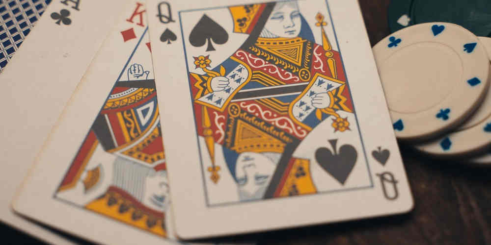 playing cards and casino chips on the table