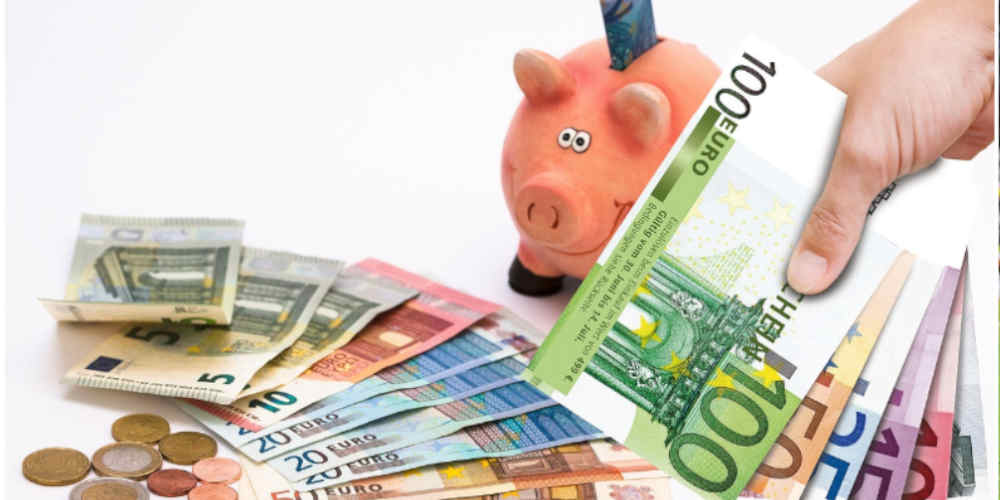 saving while travelling for european football expressed with a piggy bank and euros