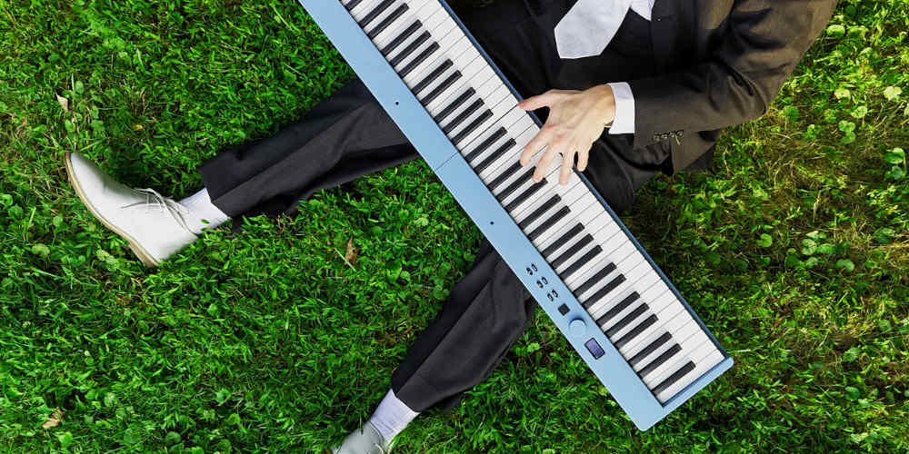 playing piano in the grass