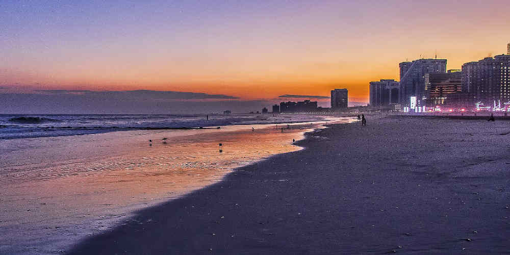 things to do in Atlantic City represented with a sunset at Atlantic City beach