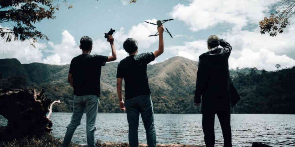 men betting on drone racing